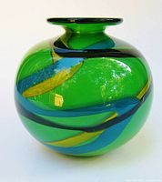 Front view of green art glass vase showing ribbon pattern