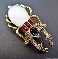 Front view showing entire brooch design and faux opal body