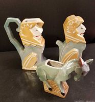 Front view showing two lion pieces and donkey pin holder