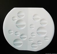 Front view showing circular relief pattern