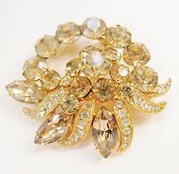 Front view of brooch showing arrangement of yellow and clear rhinestones