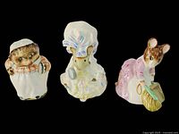 Front view of all three figurines showing characters and paint detail