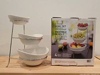 Box front next to assembled set showing product and name