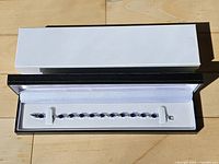 Bracelet in black presentation box, lid removed