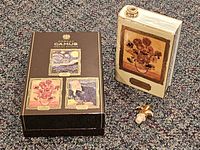 Decanter front with Sunflowers panel, stopper, presentation box top showing Van Gogh art panels