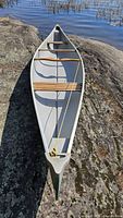 Top view of canoe showing interior, wood thwarts, bow and stern