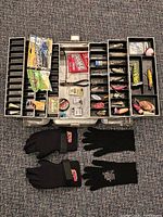 Open tackle box showing internal trays and contents