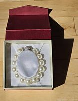Bracelet in open presentation box showing pearl size and arrangement