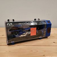Front view of helicopter inside clear Model King box