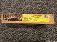 Front of boxed cast iron hibachi with product label