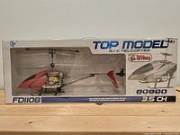 Front of sealed box showing helicopter through window