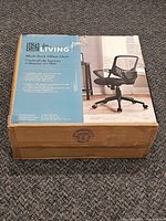 Front of unopened For Living office chair box