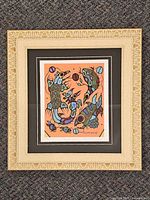 Front view of framed Norval Morrisseau limited edition print