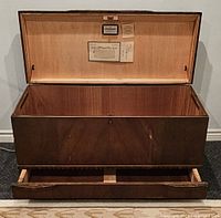 Chest open showing cedar interior and labels