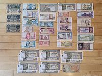 All 38 banknotes front sides laid out on floor
