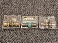 All three packaged door knob sets displayed