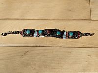 Front view of bracelet showing cabochon stones and bead accents