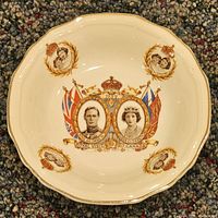 Top view of bowl showing portraits, flags, and gilded rim