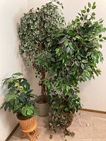 All three artificial plants with stand grouped together