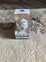 Front view of Blue Snowball microphone in box