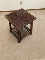 Overall view of branch wood end table, top and legs visible