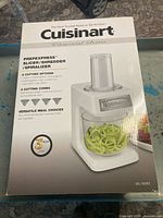 Front of sealed Cuisinart Elemental Series PrepExpress retail box showing product image and key functions.