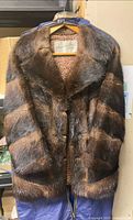 Front view of Eaton’s Fur Salon brown fur coat showing overall condition and label