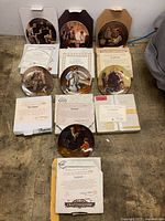 All seven plates displayed with corresponding boxes and certificates