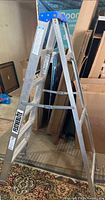 Full side view of aluminum step ladder open