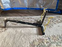 Full side view of bike carrier showing hitch insert and cradle arms