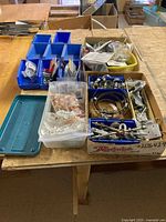 Overview showing bins and boxes with assorted clamps, ferrules, brackets
