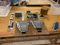 Overall view of both wrench racks and additional tools on workbench