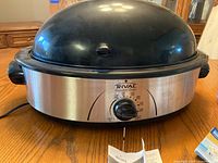 Front view Rival roaster oven showing dial and lid