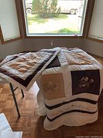 Bedspread draped to show overall patchwork design and colors