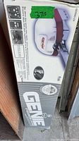 Factory box showing Genie ISD990-2X opener graphics and model details