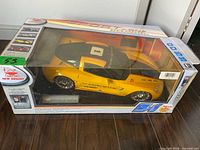 Front view of boxed New Bright Corvette C6.R RC car showing vehicle and branding