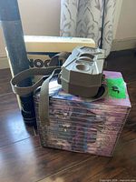 All three items together: Nikon box, Maglite flashlight, Tasco camera