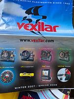 Outer packaging/catalog showing Vexilar product line and branding