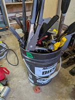 Bucket filled with assorted hand tools