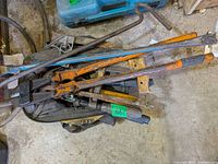 Top view showing DeWalt bag with bolt cutters, pry bars and other tools