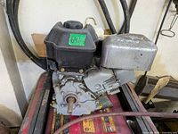 Front view showing shaft, housing, fuel tank