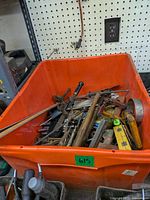 Overall view of orange tote filled with mixed tools