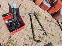 Overall lot: crate of hitch parts and two spring bars with chains