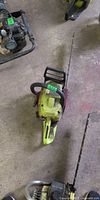 Left side view of Poulan Predator chainsaw showing full unit with bar and chain