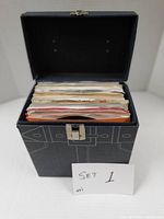 Open carrying case filled with 45 RPM records