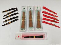 Group shot of all 14 leather watch bands showing colors and packaging