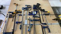 Full view of all clamps laid on workbench