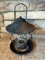 Front angled view of complete lantern-style feeder showing overall design and size