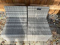 Top view of both gray wicker armless chair frames side by side