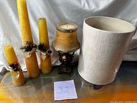 All five pieces: three candles, lamp-style candle holder, ceramic planter